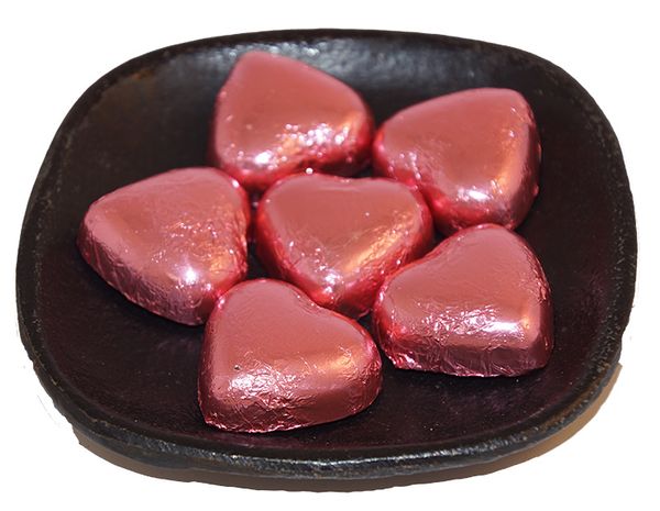 Produktbild f&ouml;r Mj&ouml;lkchoklad hj&auml;rtan med rosa papper l&ouml;svikt Produktbild f&ouml;r Milk chocolate hearts with pink paper loose