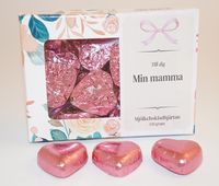 Chokladhj&auml;rtan rosa papper i ask A