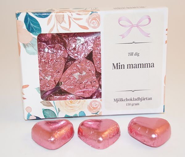 Chokladhj&auml;rtan rosa papper i ask A Chocolate hearts pink paper in box A