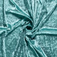 Krossad plysch är ett stickat tyg som är töjbart.  Har en fin oregelbunden lyster då luggen på tyget är klippt på ett speciellt sätt.