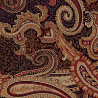 Viskos jersey med paisley mönster i rostfärg på svart bakgrund.